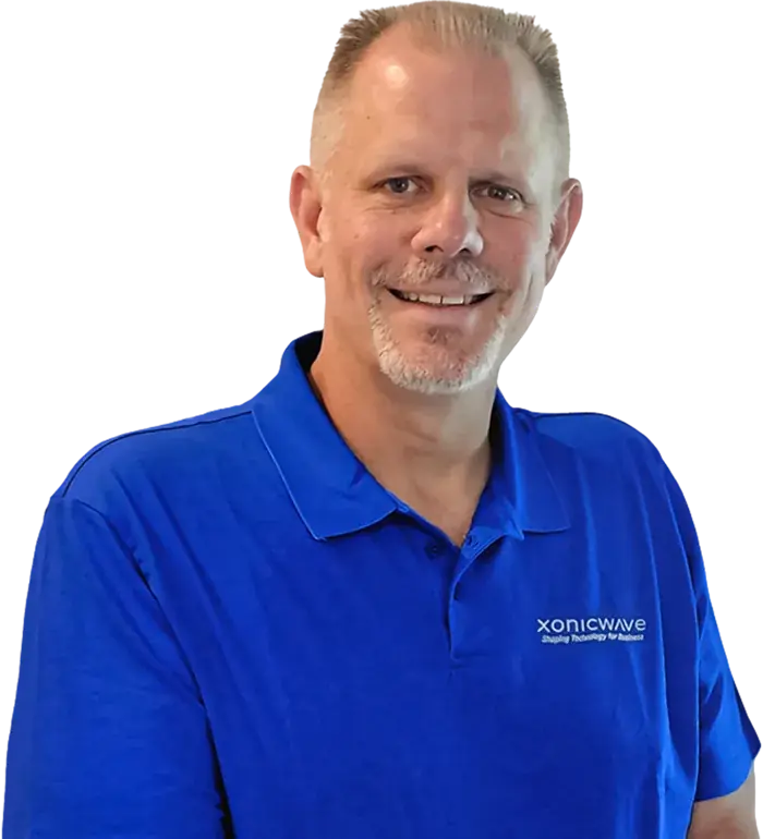 Ben Huey, Director of Cybersecurity, in a blue Xonicwave polo